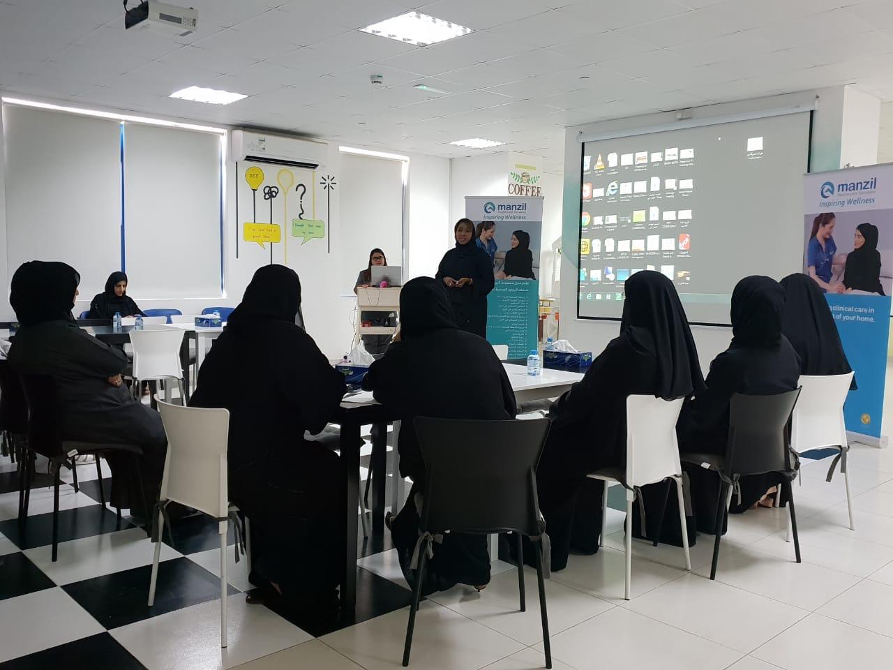 eight woman in black Arabic dresses in a conference