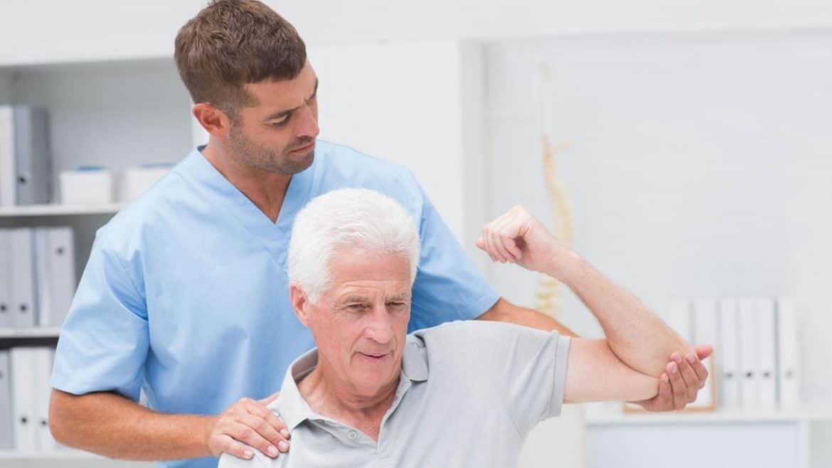 physiotherapist and elder patient